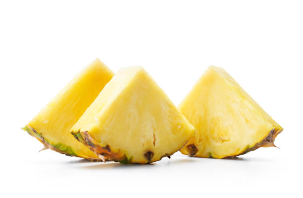 istock Slices of fresh pineapple with shadow 1442497517