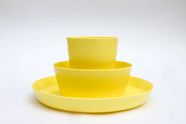 istock Yellow plastic dinnerware, bowl, plate and cup isolated on white background 1442498667