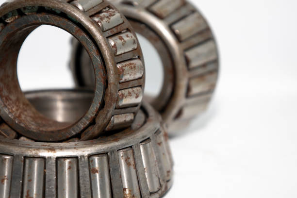 istock old roller bearing with traces rust, isolated on white background. 1442498812
