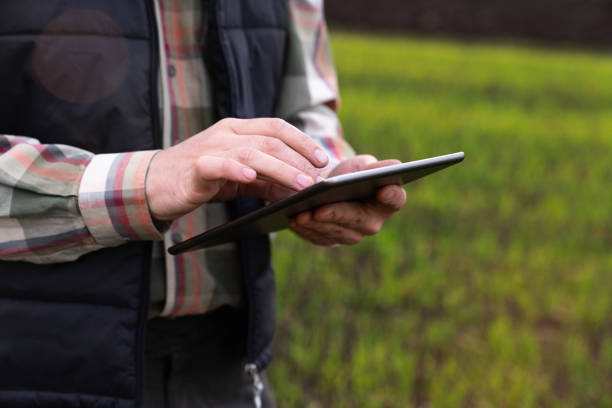 istock Farmer with digital tablet on an agricultural field. 1442498990