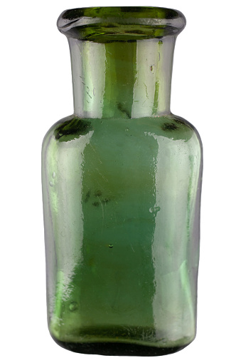 Retro vintage apothecary green glass bottle isolated on white background