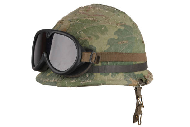 istock US Army Vietnam era M1 helmet shell, liner & Mitchell pattern camouflage cover with protective goggles 1442499999