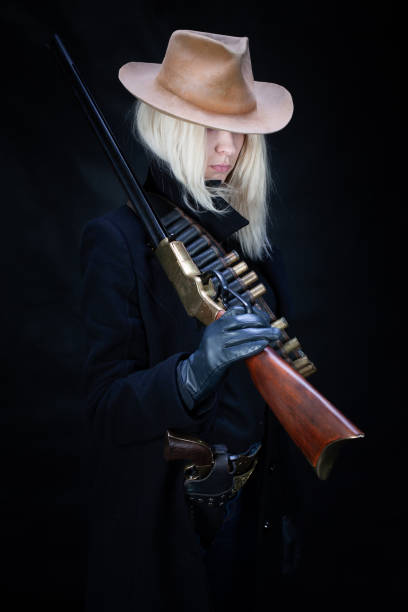 istock wild west blonde girl with rifle 1442500143