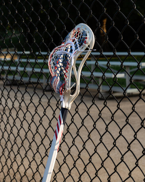 istock Mens Lacrosse Stick Leaning on a Fence 1442501582