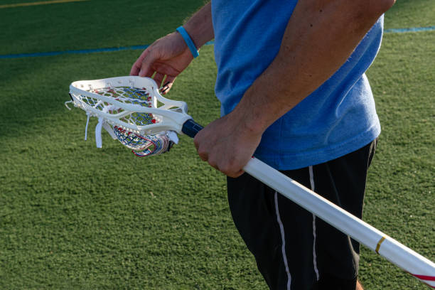 istock Man holding a lacrosse stick 1442501591