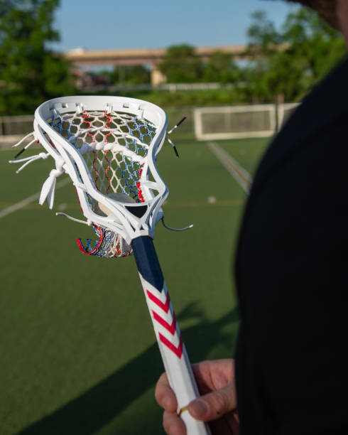 istock Man holding a lacrosse stick 1442501622