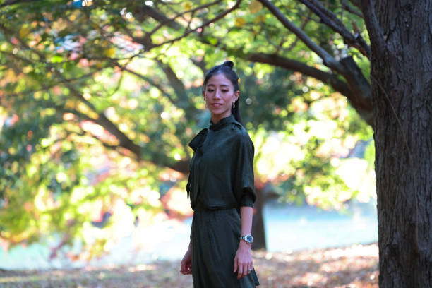 istock Beautiful lady relaxing at pond side 1442501632