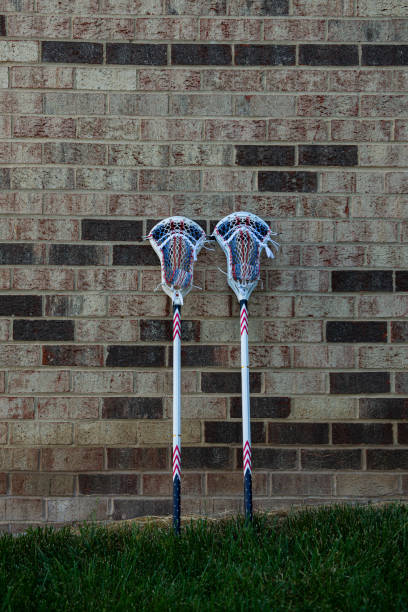 istock Men's Lacrosse Stick Leaning on Brick Wall 1442501656