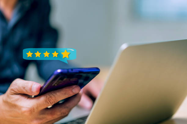 istock Close up client man hand using smartphone with pop up five star icon for feedback review satisfaction service, Customer service experience and business satisfaction survey, Positive feedback 1442502859