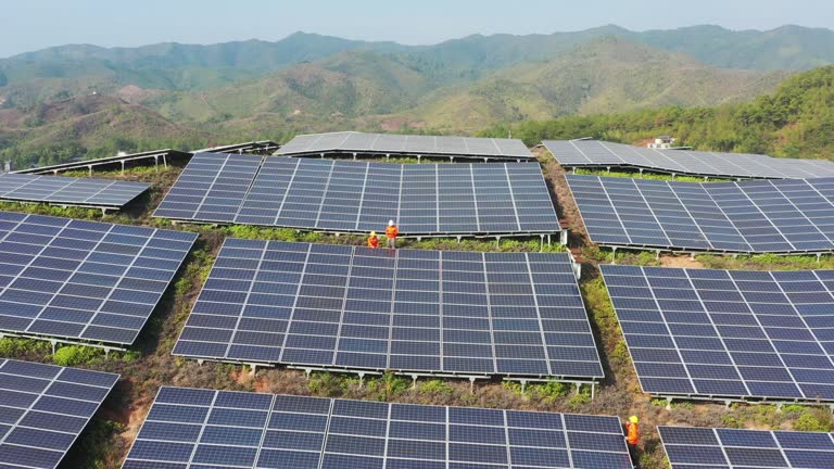 Engineer checking and repairing solar panels