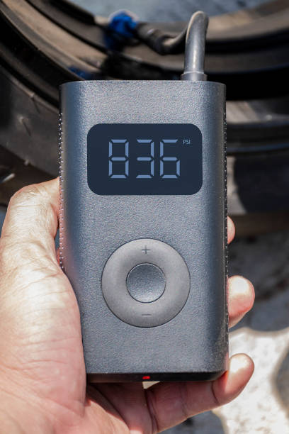 istock Hand holding a portable inflator is inflating a motorcycle tire. 1442506367