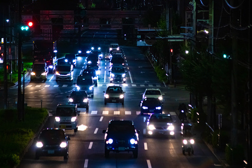 A night traffic jam at the downtown street in Tokyo long shot. High quality photo. Nishitokyo district Higashifushimi Tokyo Japan 09.30.2022 Here is a city street in Tokyo.