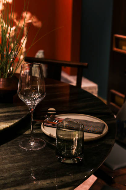 istock Asian Restaurant table with place setting and wine glasses in dark evening atmosphere 1442510369