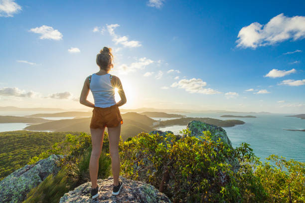 istock Woman hiker taking in view on top mountain overlooking ocean 1442510974