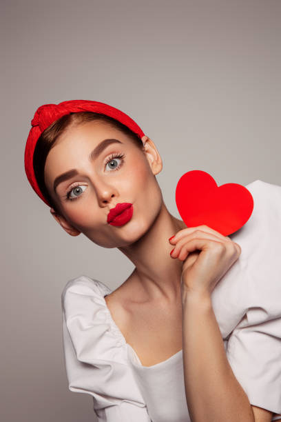 istock Beautiful emotional woman holding present box 1442513439