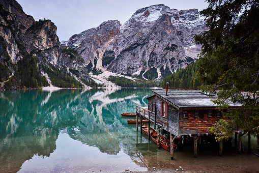 Lago di Braies or Pragser wildsee, Italy. Spectacular romantic place with typical wooden boats on the alpine Lake Braies, Dolomites, South Tyrol.