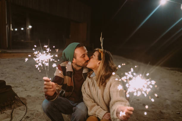 Photo of a happy couple having an outdoor Christmas Eve.