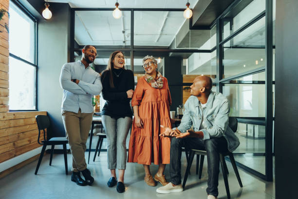 istock Business colleagues laughing happily in a modern office 1442522248