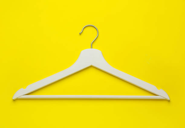 istock Empty wooden hanger on yellow background, top view 1442524892