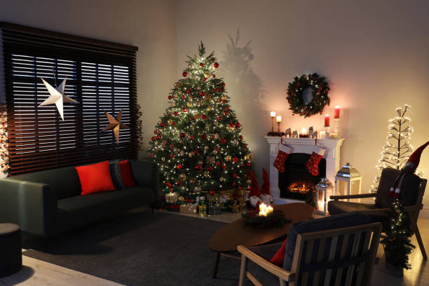 istock Cozy living room interior with beautiful Christmas tree and fireplace 1442528655
