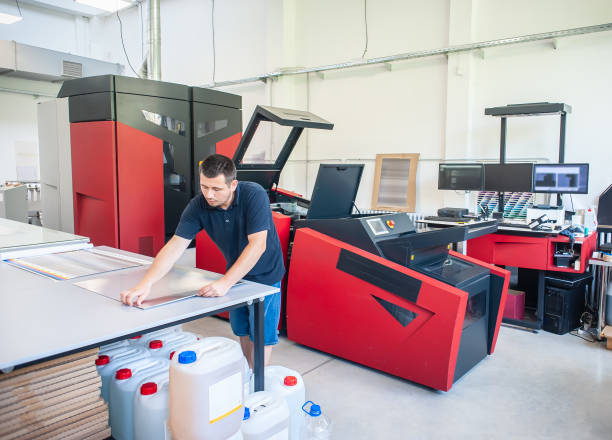 istock Professional worker with modern offset printing machine in print house 1442529944