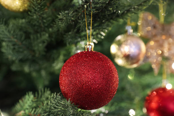 istock Beautifully decorated Christmas tree with red bauble, closeup 1442530374