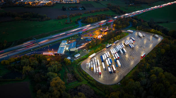 istock Highway and rest area at dusk - aerial view 1442534226