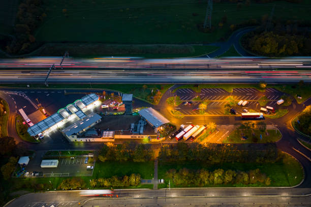 Highway and rest area at dusk - aerial view stock photo