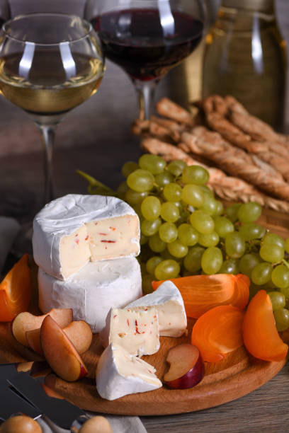 Cheese camembert with fruit and wine stock photo