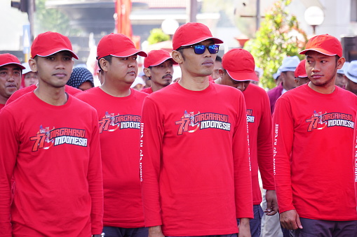 Blitar, East Java, Indonesia - August 4th, 2022 : Indonesian participating in marching (baris berbaris) to celebrate Indonesian independence day