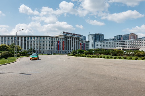 Pyongyang, North Korea - July 27, 2014: State Planning Commission near the Arch of Triumph in Pyongyang. Moranbong Street