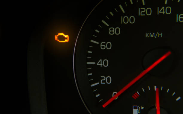 orange check engine light on the dashboard yellow check engine light indicating an engine fault with which you should go to the garage for diagnostics. This can be caused by a lambda sensor fault or a catalytic converter fault. engine failure stock pictures, royalty-free photos & images