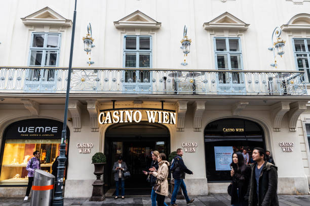 Vienna, Austria - October 14, 2022: Facade and sign of the Casino Wien with people around in Karntner street, a shopping street in Vienna, Austria