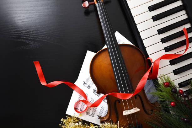 istock Christmas performance concept with violin and piano on black table 1442551681