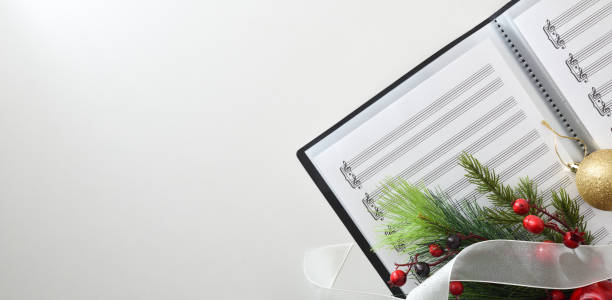 istock Choral christmas performance concept with sheet music on white table 1442551754