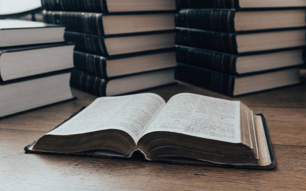 istock Pile of thick books on the table 1442551827