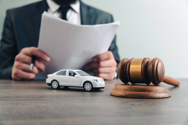 Judge with toy car and gavel stock photo