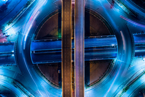istock City interchange closeup at night, Smart Modern city night background and wireless communication network, wuhan city interchange in nightfall, Aerial view of Chicago by night. 1442552201