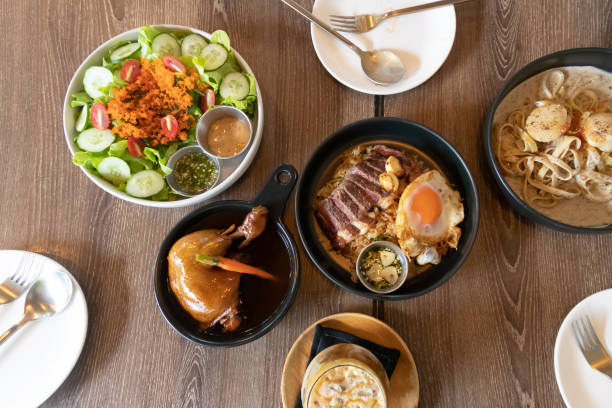 istock Assorted fusion food on wooden table. 1442552222
