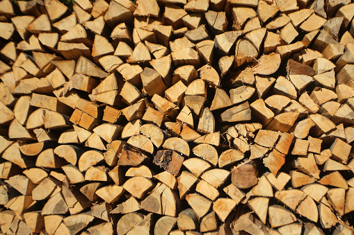 Stacked cut firewood perfect for backgrounds.