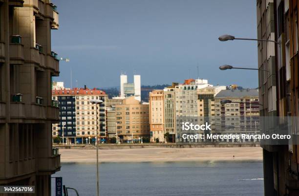 A Coruña Cityscape Seen From Narrow City Street Seascape Beach And Waterfront Apartment Buildings Stock Photo - Download Image Now