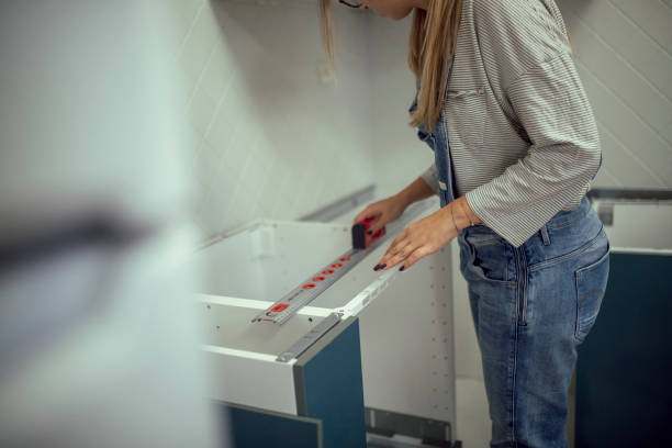 istock An unrecognizable woman uses measuring tool to measure while renovating apartment 1442569573