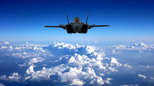 istock F-35 fighter jets flying over clouds 1442569750