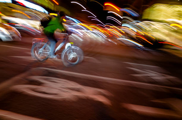 Cyclist riding at night in Toronto : Vibrant colors