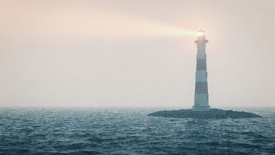 Lighthouse on the sea in a rain and storm.