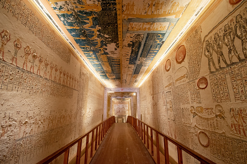 Valley of the Kings, Luxor, Egypt - July 22, 2022: The tomb of Ramses V and Ramses VI is also known as KV9. Tomb KV9 was originally constructed by Pharaoh Ramesses V. He was interred here, but his uncle, Ramesses VI, later reused the tomb as his own.\n\nThe tomb has some of the most diverse decoration in the Valley of the Kings. Its layout consists of a long corridor, divided by pilasters into several sections, leading to a pillared hall, from which a second long corridor descends to the burial chamber.