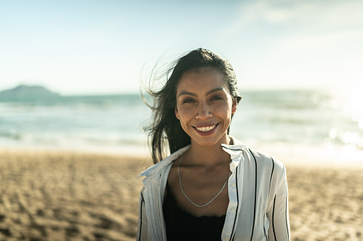 Portrait of young woman at the beach