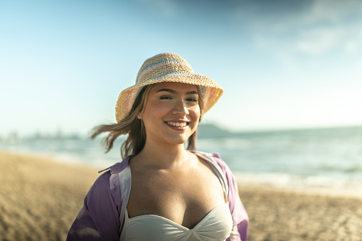 Portrait of young woman at the beach