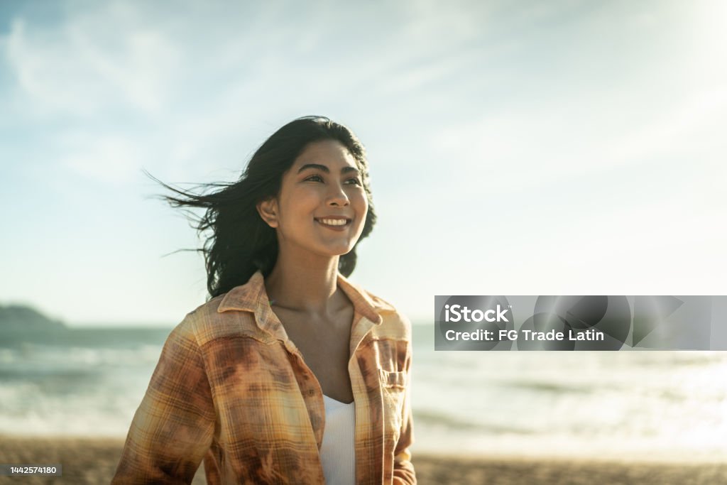 Young women contemplating at the beach Mental Health Stock Photo