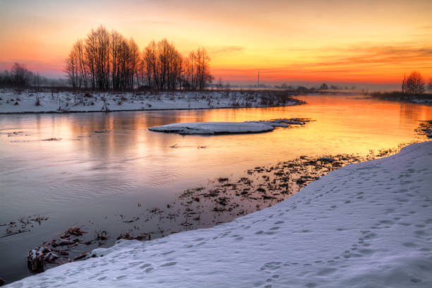 istock Landscape - sundown in river valley, winter time 1442574288